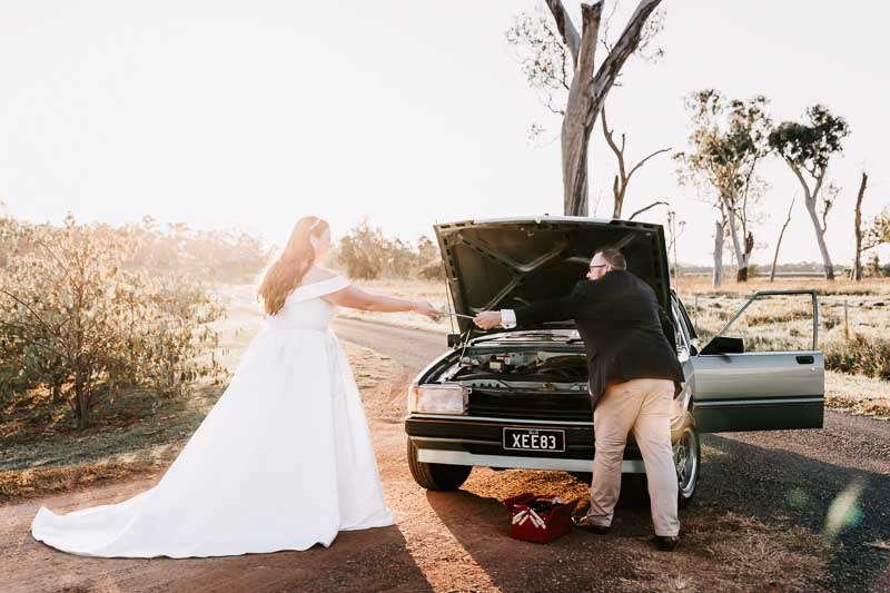 Bride assists Groom with car