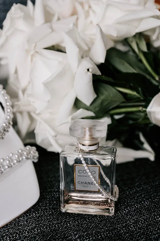 Brides perfume, shoes and bouquet
