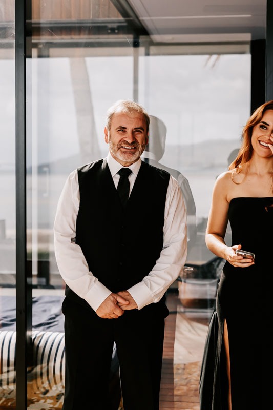 Father and Bridesmaid smile
