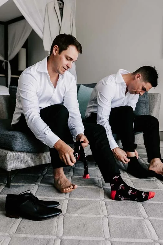 Groom & Groomsmen putting on socks
