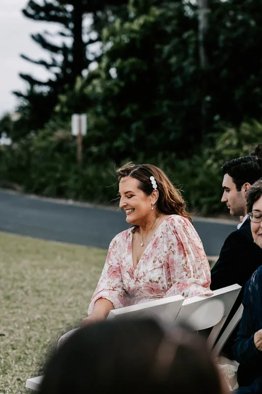 Mother smiles at ceremony