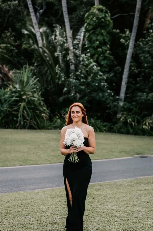 Bridesmaid walks to arbor