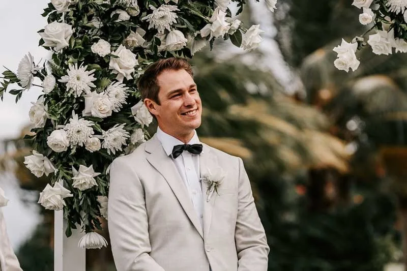Groom smiles awaiting Bride