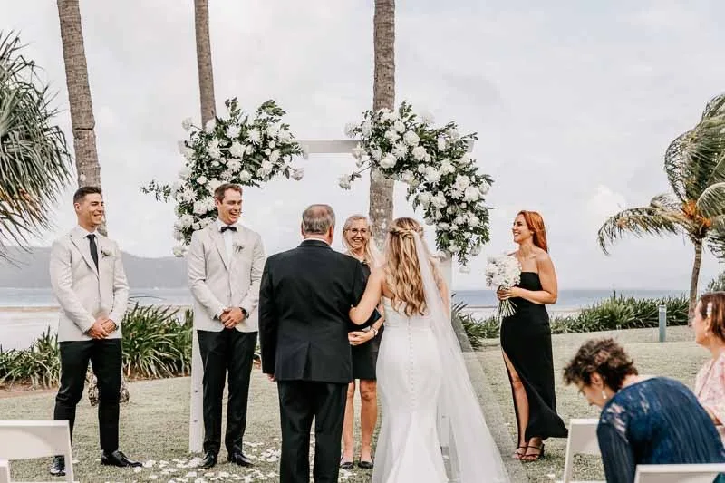 Bridal party at arbor