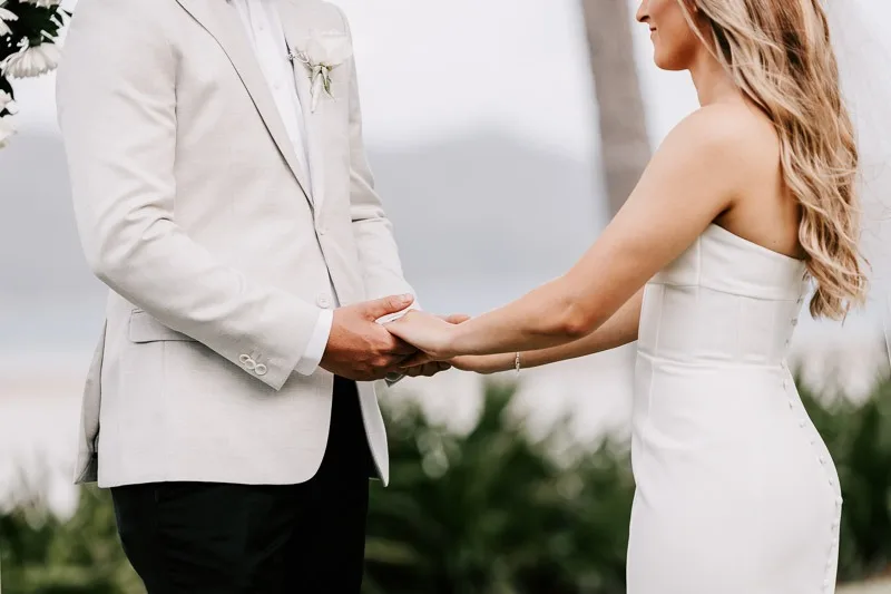 Bride & Groom holding hands at ceremony