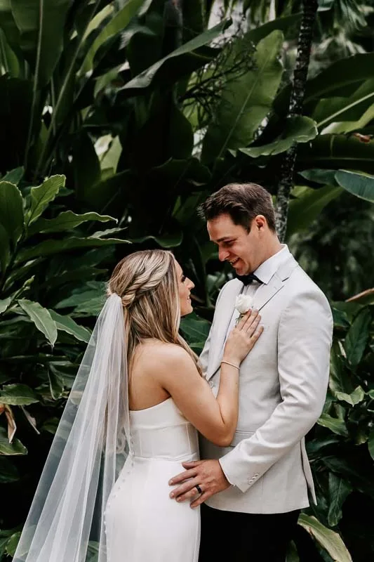 Bride gives loving touch to Groom