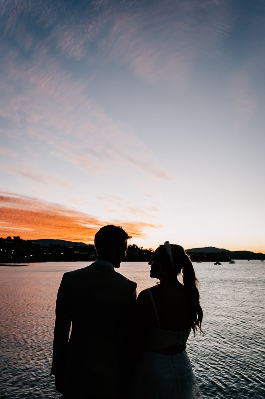 Bride & Groom with sunset behind