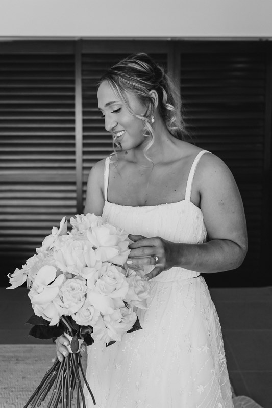 Bride admiring bouquet