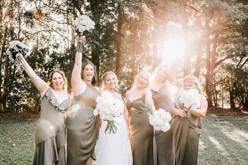 Bride celebrates with bridesmaids