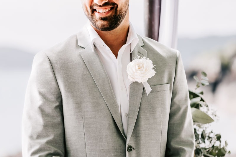 Grooms smile and buttonhole