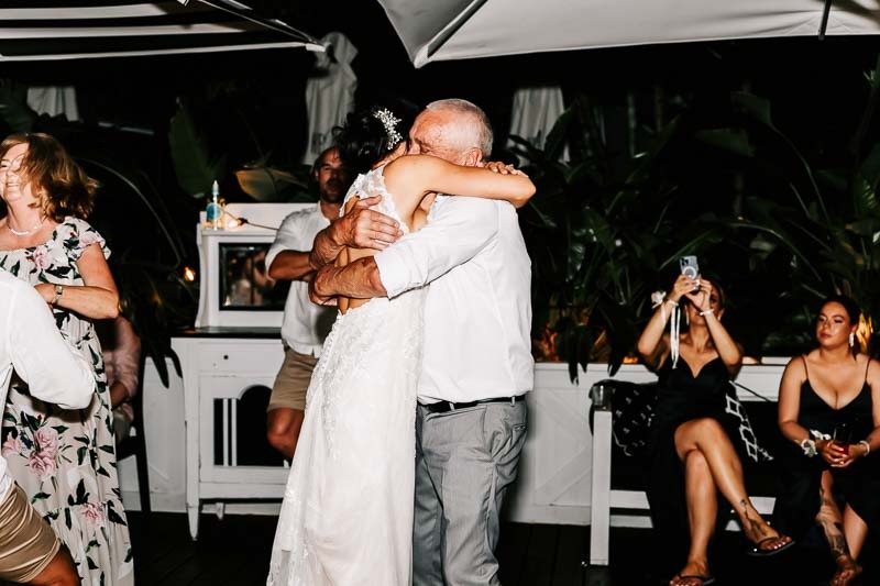 Bride embracing father