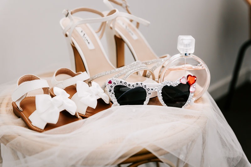 Brides shoes sunglasses and perfume