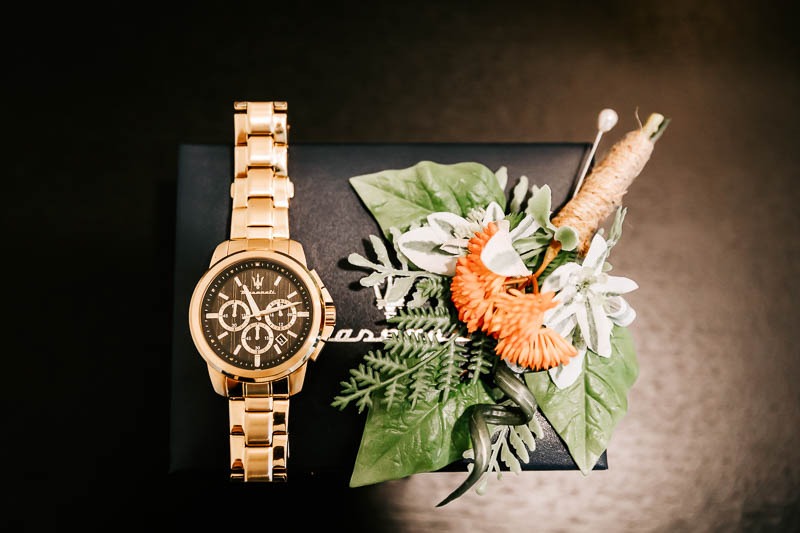 Grooms watch and buttonhole