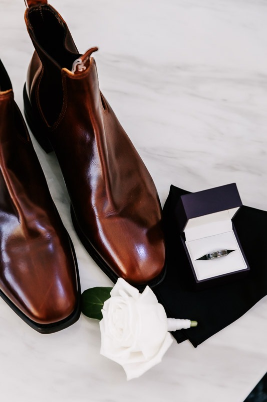 Grooms shoes,ring and buttonhole