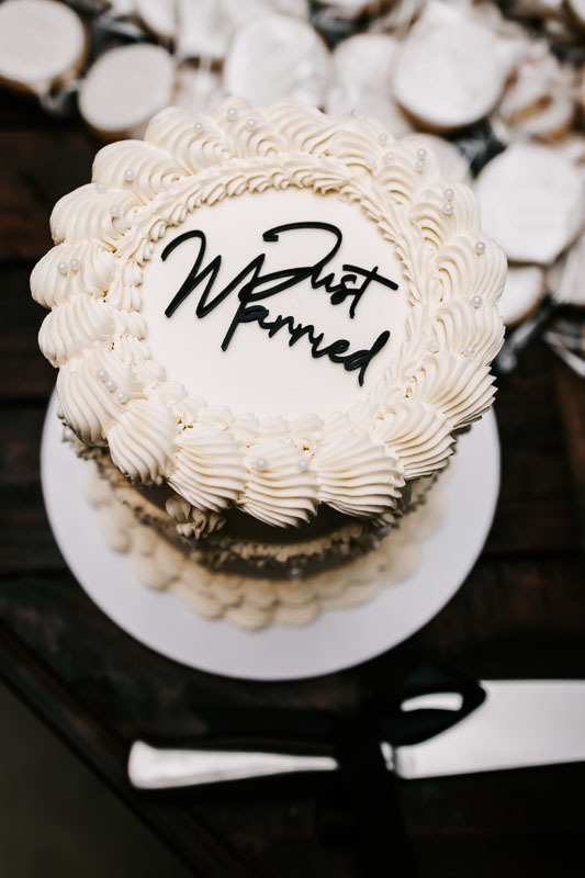 Just Married written on wedding cake