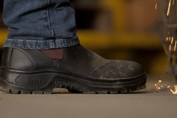 rossi boots in workshop with sparks