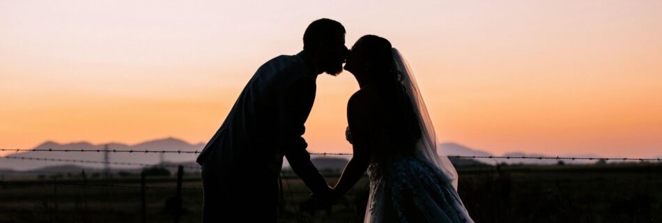 Professional videography photography drone footage at sunset wedding