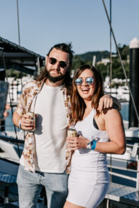 FCTA May22-Th3rd Dimension Media-LR-123 Candid moment between Flight Centre staff during retreat event at Coral Sea Marina