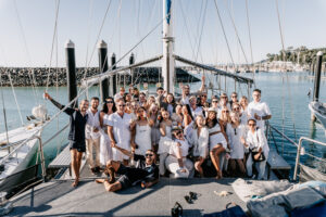 FCTA May22-Th3rd Dimension Media-LR-134 Group photo of Flight Centre team on yacht deck in Airlie Beach, Queensland