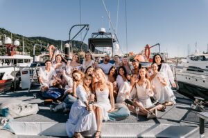 FCTA May22-Th3rd Dimension Media-LR-55 Smiling Flight Centre attendees dressed in white enjoying staff retreat in the Whitsundays