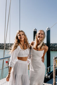 FCTA May22-Th3rd Dimension Media-LR-58 Team seated on yacht deck for group activity during Flight Centre event in QLD