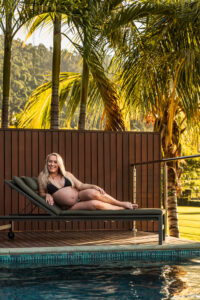 YGRO-Babymoon-TDM-LR-9 Expecting mother reclining on sun lounger surrounded by tropical palms, Funnel Bay