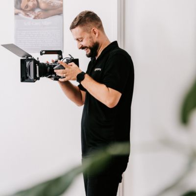ultra-medi-spa-float-bts Videographer holding camera while filming