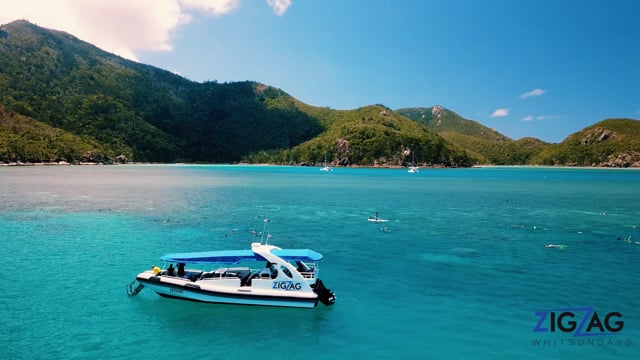 Professional videography and aerial view of a scenic blue bay