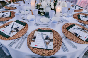 Professional videography photography and drone footage of elegant table setup with menus and candles.
