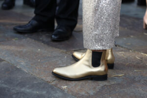 Full Gallery Ag Day 24-LR-112 Professional videography, photography, and drone footage of stylish gold shoes at fashion event