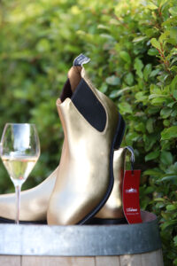 Full Gallery Ag Day 24-LR-114 Professional videography of golden boots with glass outdoors