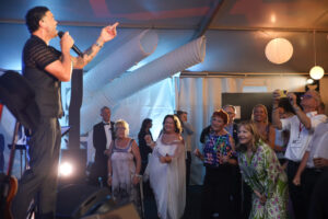 Full Gallery NMD 24 LR-574 Professional videography and photography at a lively event