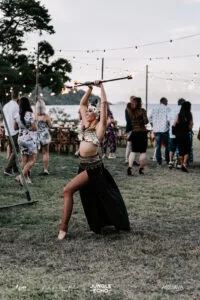 Professional videography outdoor fire dancer at lively event