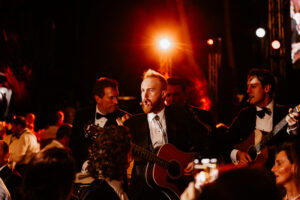 Professional videography at elegant event with live musicians