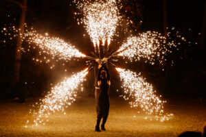 Professional videography, photography, and drone footage show performer with fireworks display