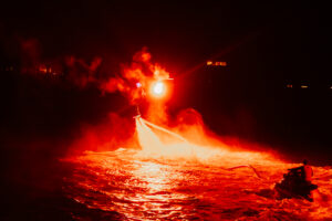 Professional videography capturing dramatic night water scene