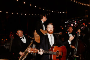 Professional videography and a lively band performing on stage