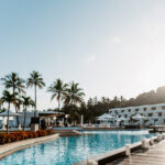 Resort lifestyle photography – poolside bar and palm trees