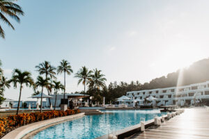 Resort lifestyle photography – poolside bar and palm trees