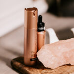 Product photography – skincare bottle on stone and wood styling