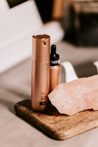 Product photography – skincare bottle on stone and wood styling