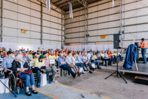 Corporate event photography – audience seated in industrial venue