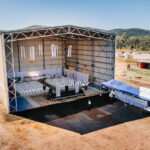 Aerial event venue photography – large stage in rural setting