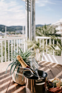 Balcony lifestyle photography – champagne bottle with ocean view