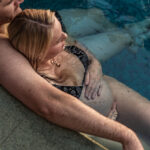 Maternity poolside photography – couple relaxing by the pool