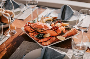 Aerial yacht photography – boat on deep green water