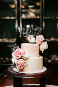 Professional videography wedding cake with elegant floral decor