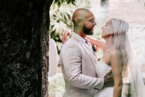 Professional videography wedding couple embrace in lush garden
