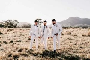 Professional videography photography and drone footage of three men in a field