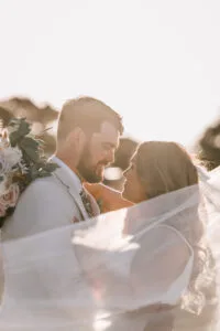 Professional videography capturing intimate wedding moment outdoors